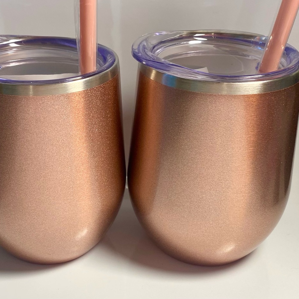 Set of 2 Rose Gold 12 oz insulated wine tumblers with lids and straws.